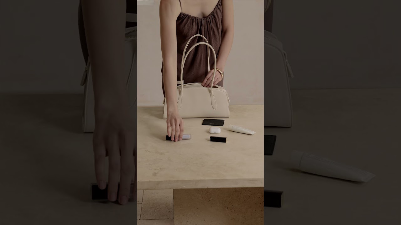 What fits inside the Gabrielle East&ndash;West Shoulder Bag?