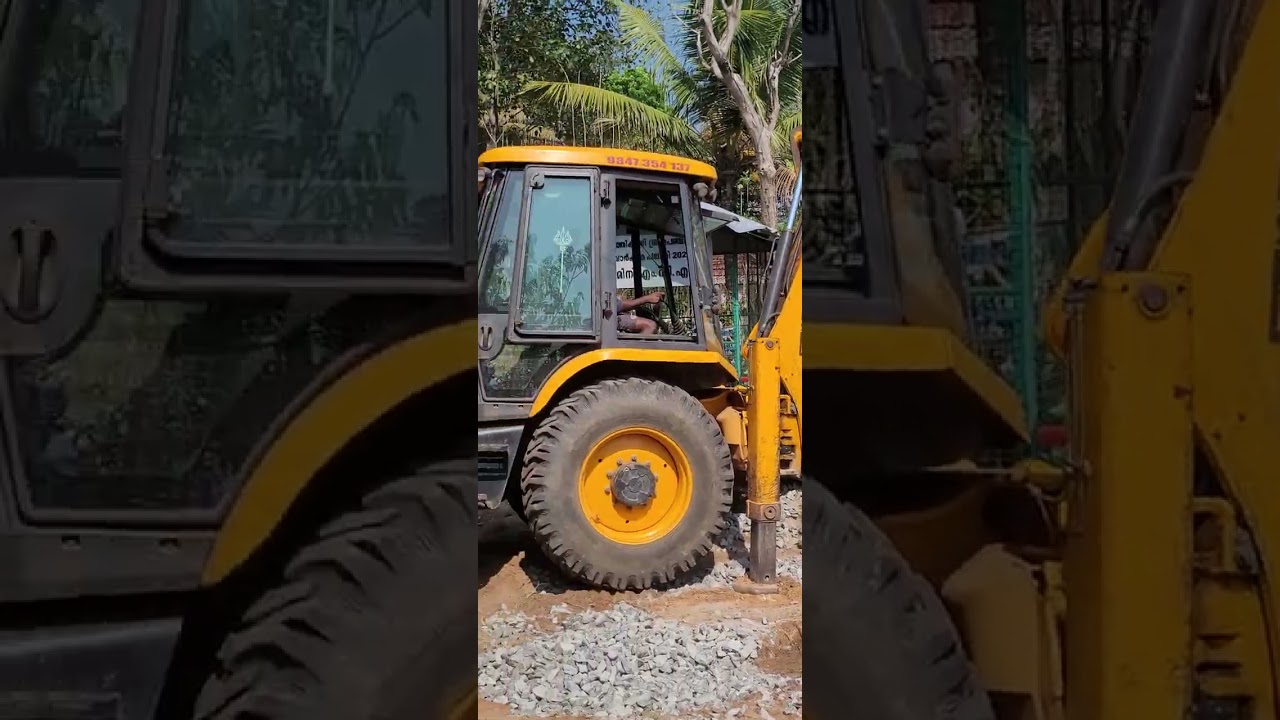 JCB ഉപയോഗിച്ച് മണ്ണ് മെറ്റലും കൂട്ടിയിട്ടിരിക്കുന്നത് ടിപ്പർ ലോറിയിലേക്ക് മാറ്റുന്നു