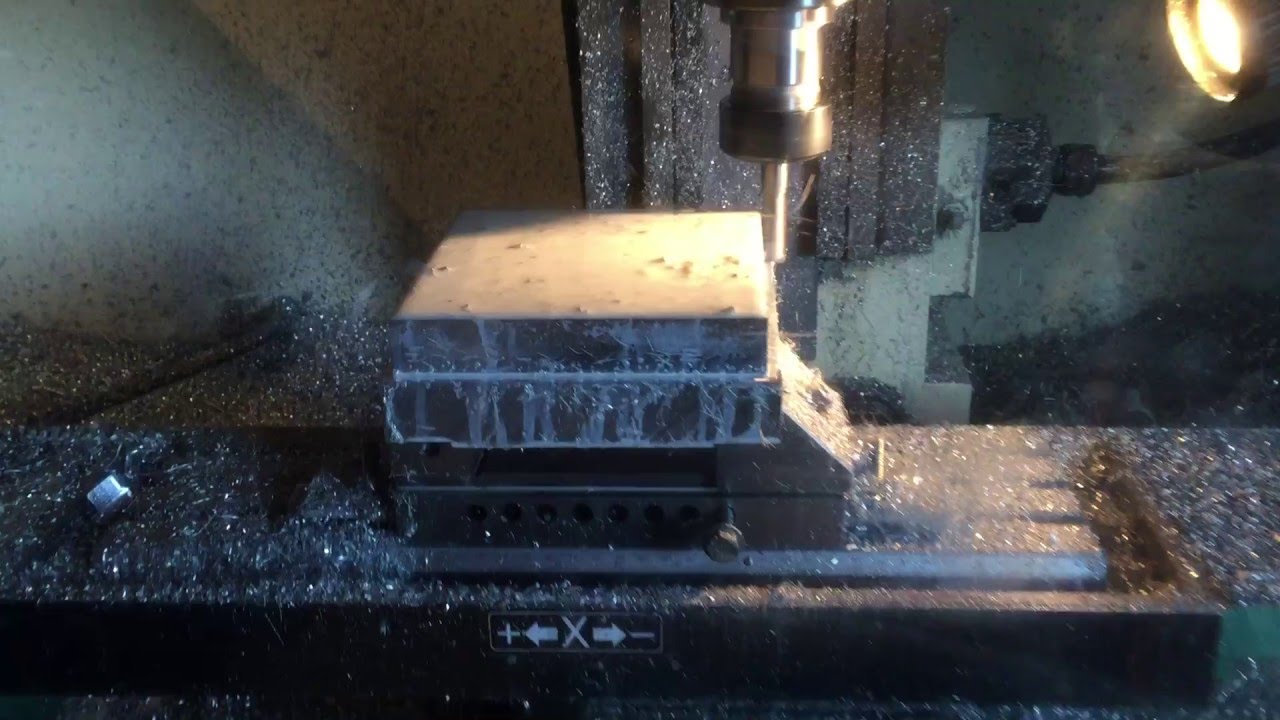 Denford Triac machining wheel hub adapters.