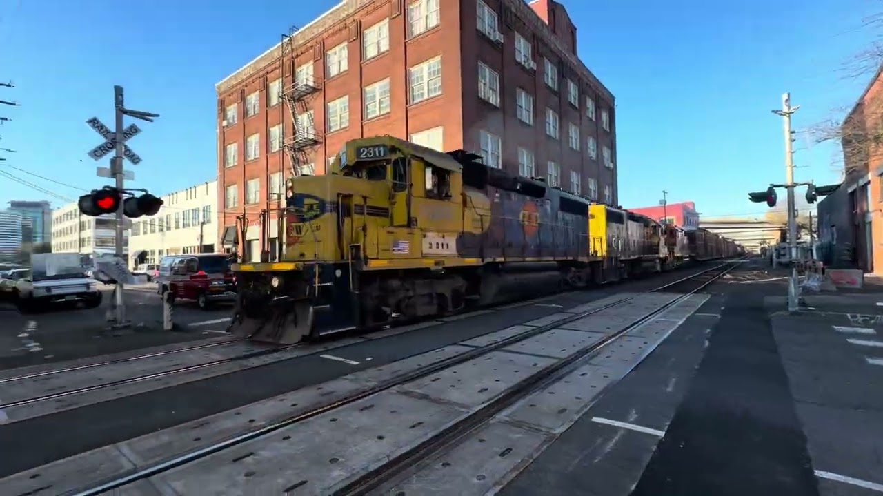 PNWR #2311 leading the Albina local through the alley in Portland, OR at 3:13 PM