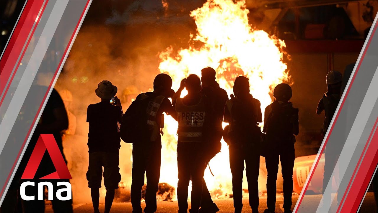 Hong Kong protesters set fire to Wan Chai MTR station entrance