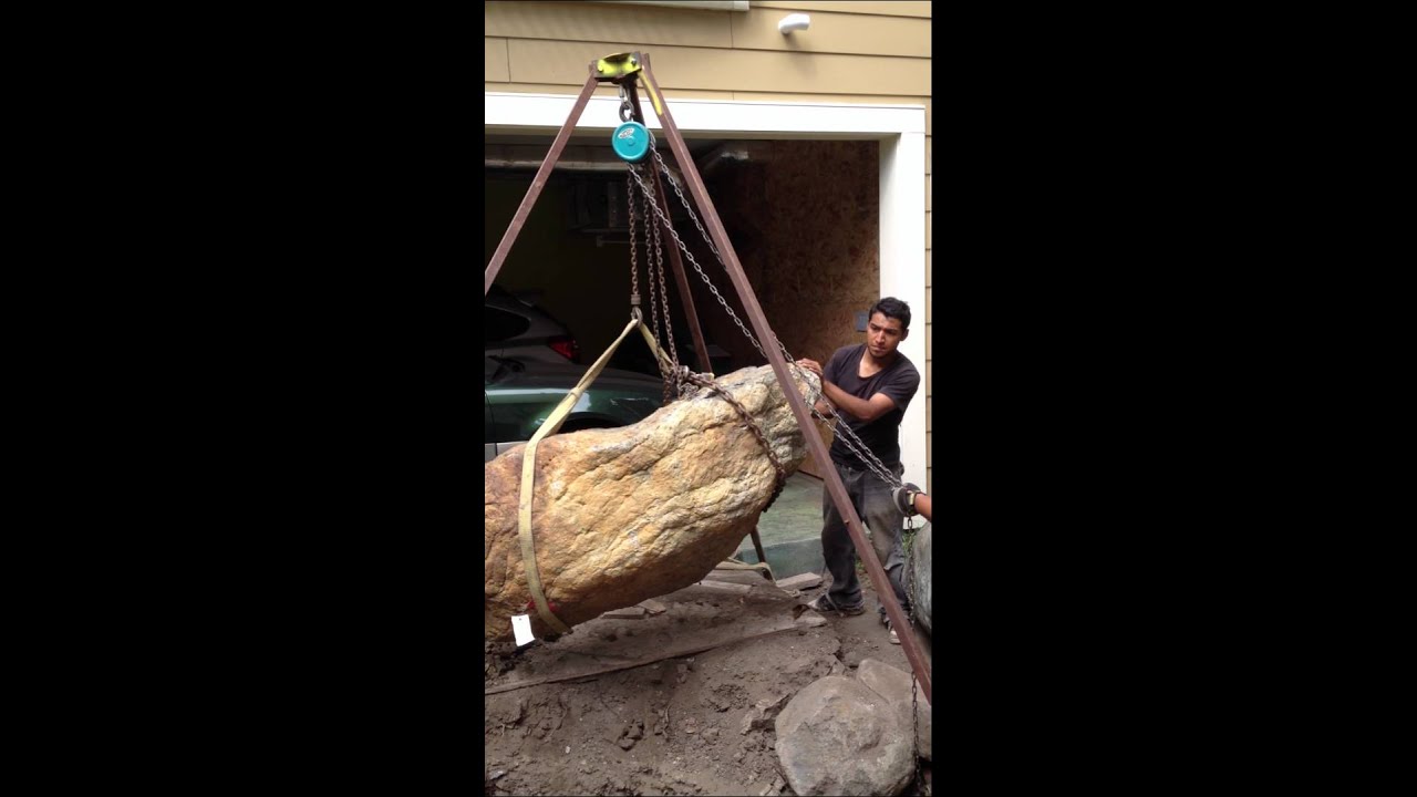 Moving a large boulder without heavy equipment