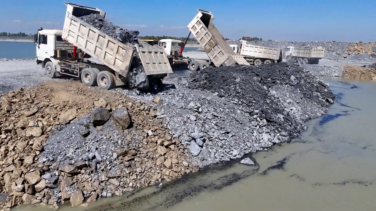 Amazing Huge Lake Filling Stone Process Bulldozer Clearing Stone and Dump Truck Unloading Stone