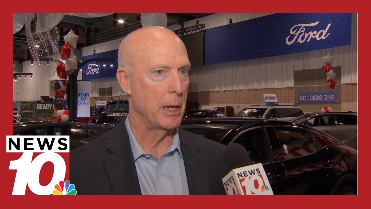 How are changes to electric vehicle tax credits impacting the auto industry?