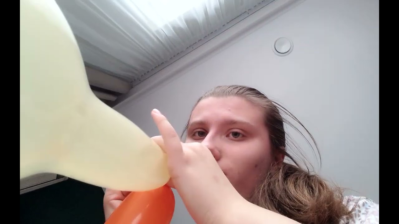 The boys blow balloons