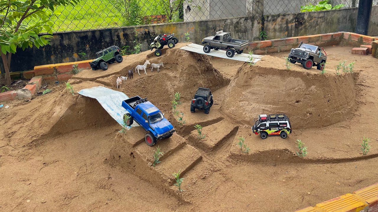 Rc car racing on the top of the mountain, crossing the bridge,Rc Hilux Jeep Crawler Toyota Defender.