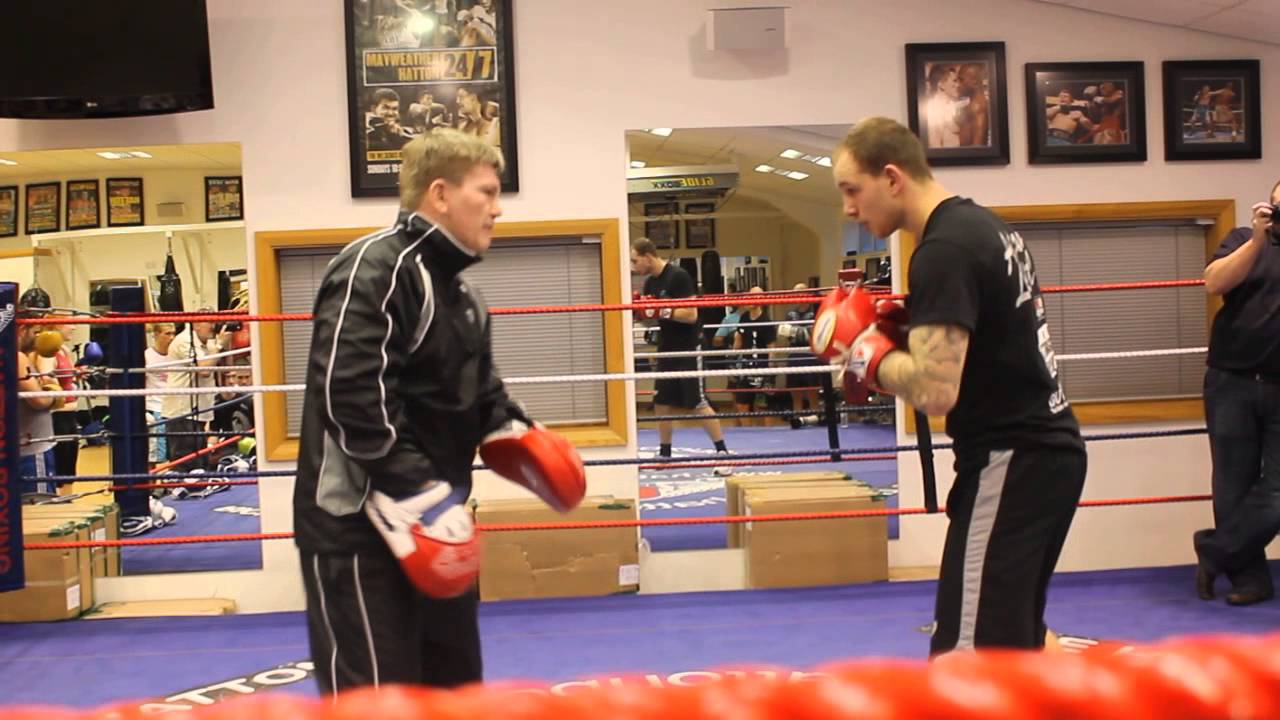 Ricky Hatton holding the pad's for Adam Little at boxing workshop