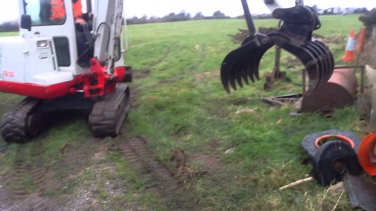 Mini digger with grab