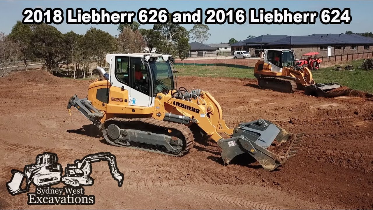 2 Diggers pushing around dirt