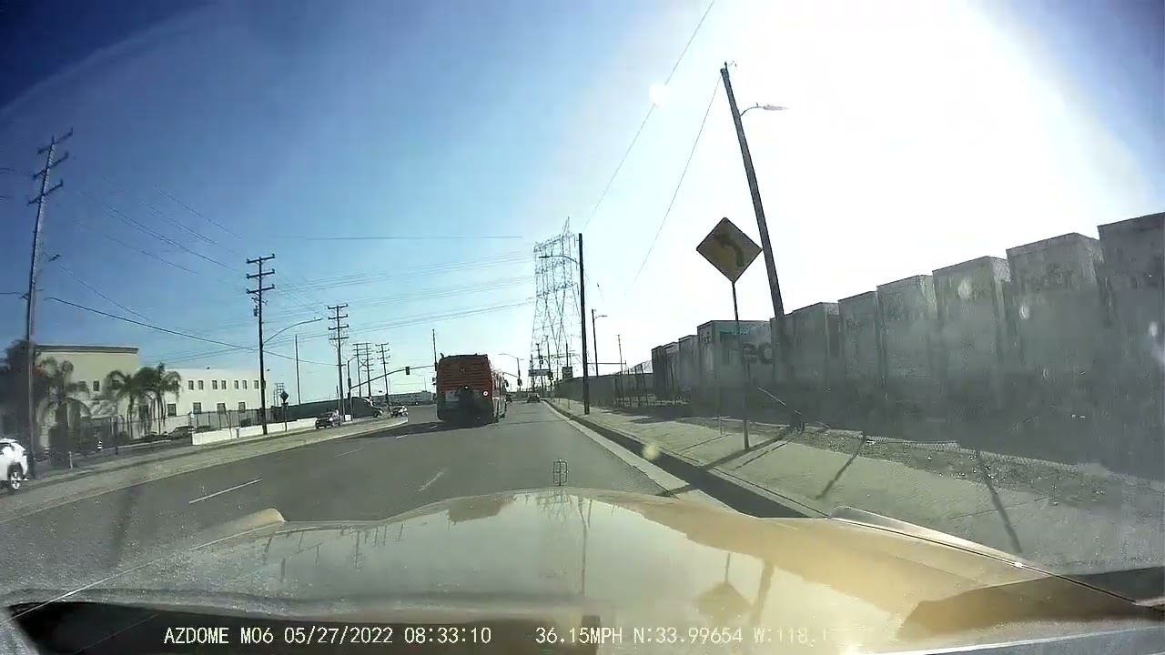 Person riding on back of metro bus
