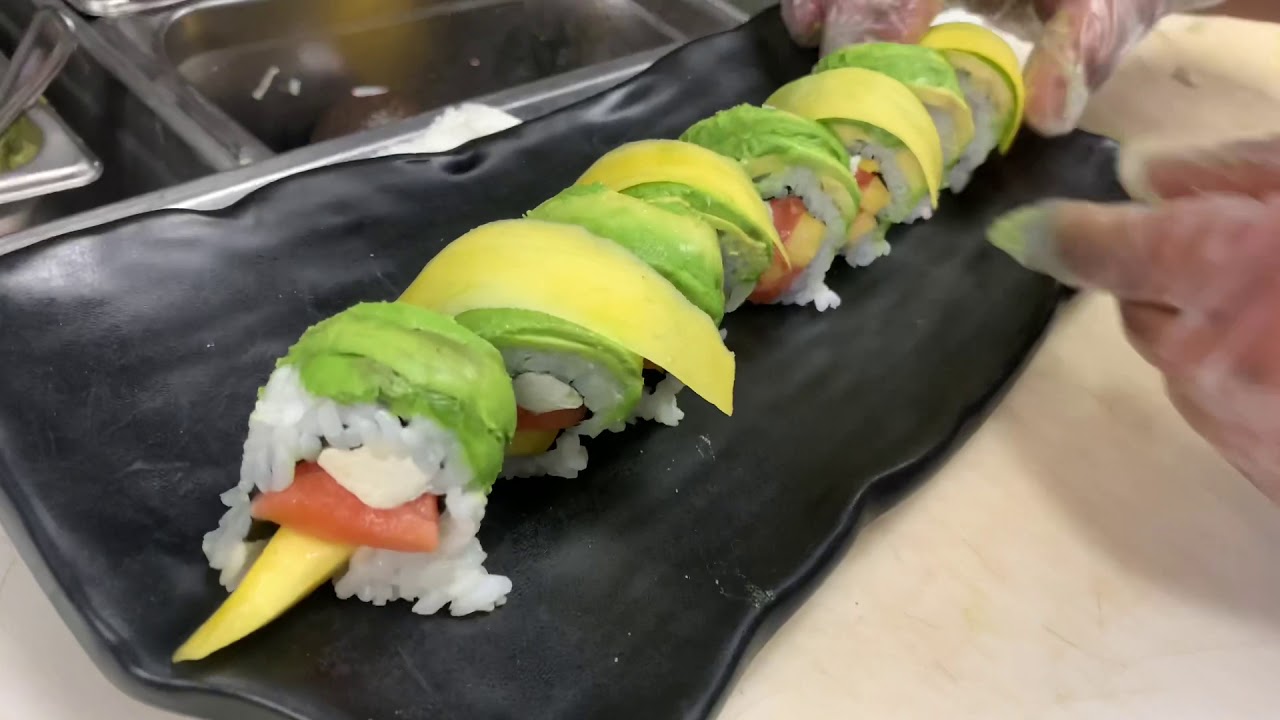 Making a sushi roll at Sushiway