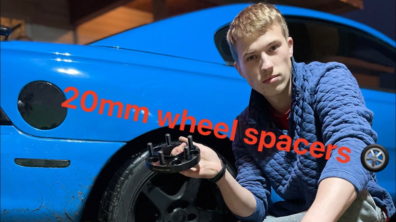 Installing wheel spacers.