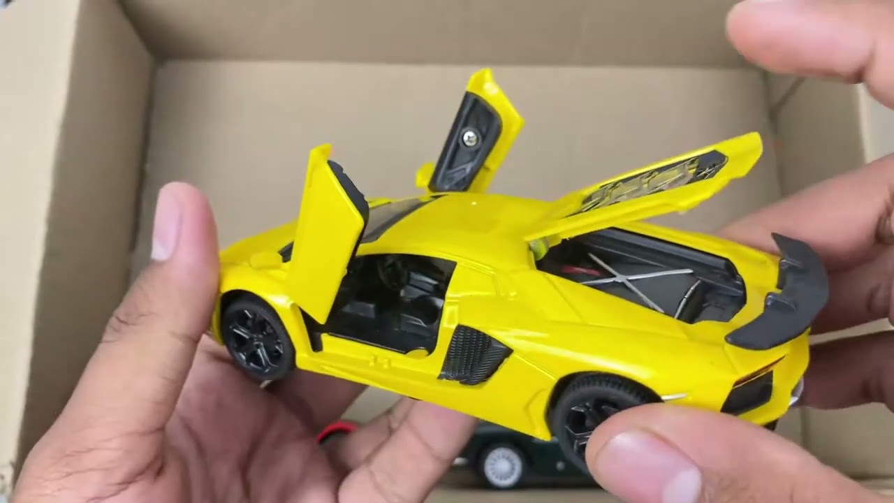 Box Full of Model Cars -Tesla Robotaxi, Tesla Cybertruck, Tesla Roadster, Lexus LC500, Lexus Lm 300h