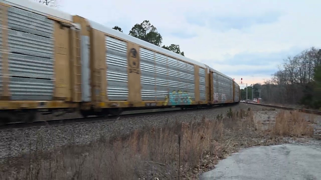 NS 4384 knocks down the green with the northbound graffiti train..NS 4498 is the rear pusher 