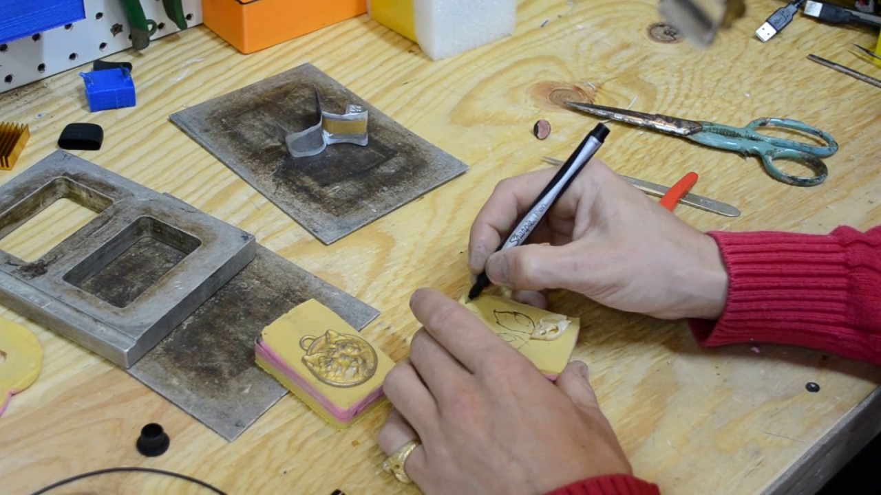 Jewelry Mold Making Splitting a Vulcanized Rubber Jewelry mold Seashells and Cat Pendant