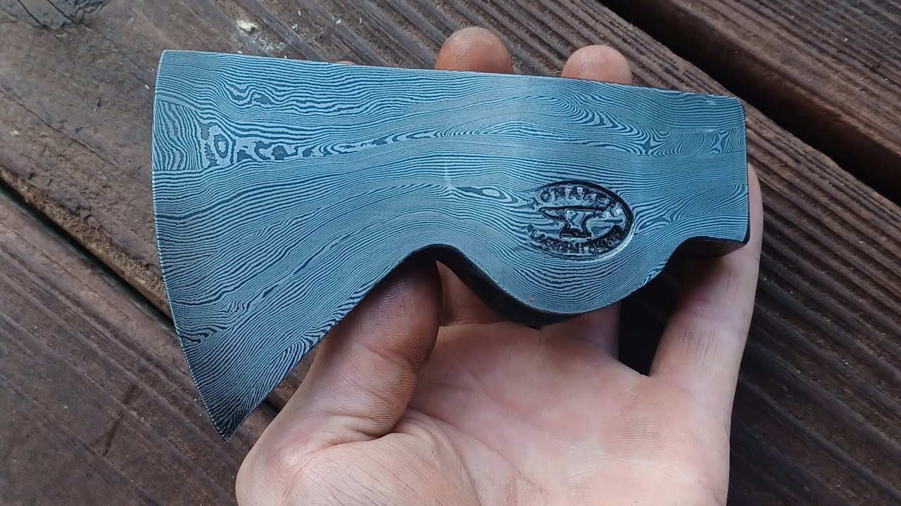 Forging a damascus axe.