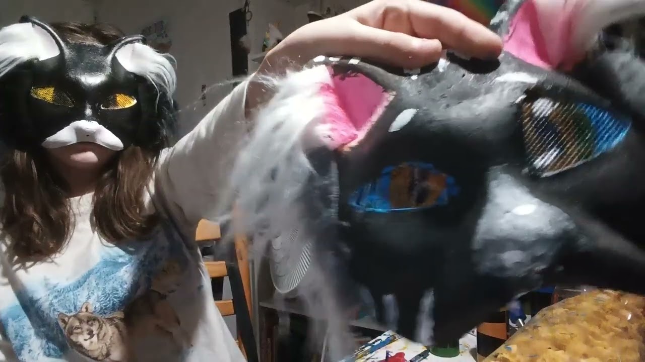 I paint an eye on my wolf mask