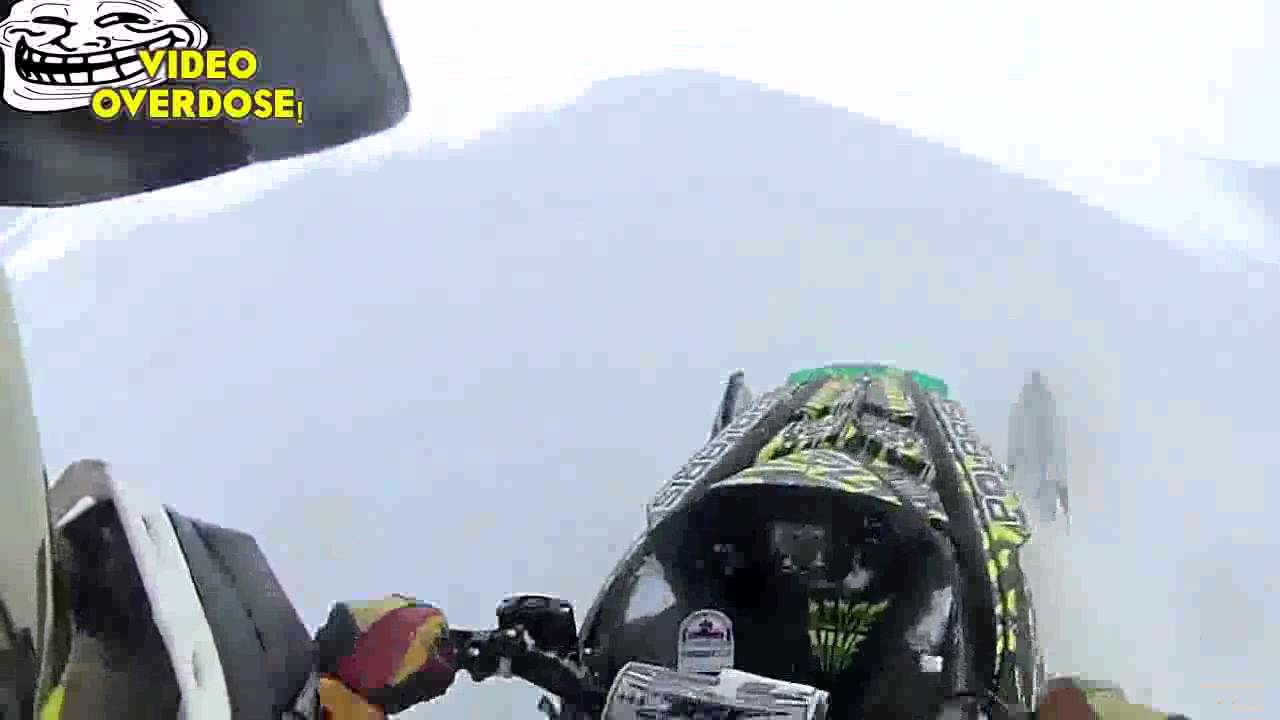100 foot Snowmobile Cliff Jump INSANE