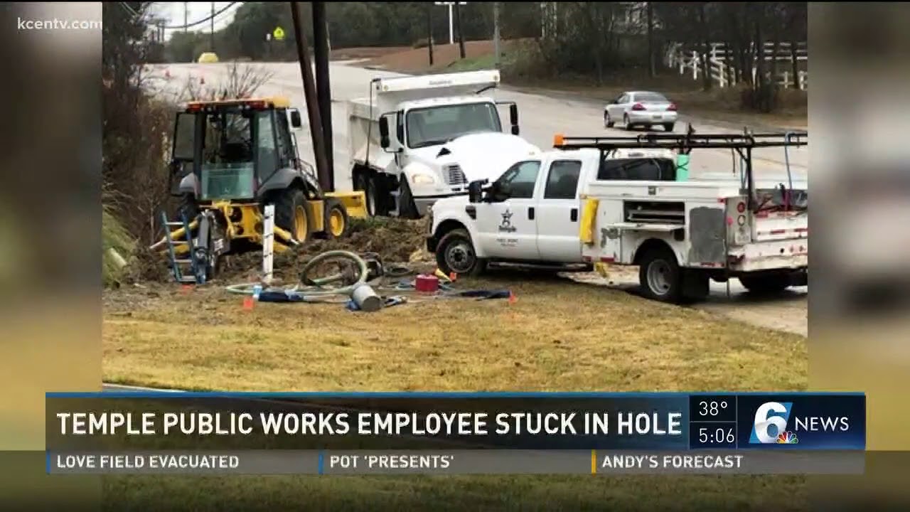 Temple public works employee stuck in hole