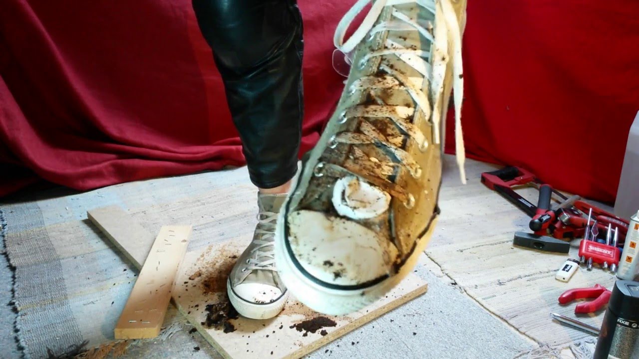 Gray Converse sneaker destroy #1 in motorcycle gear