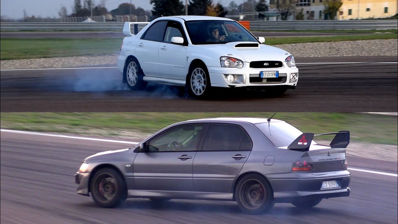 CRAZY SHOW!! Impreza STi vs Lancer Evo - Powerslides, flames, launch & sound