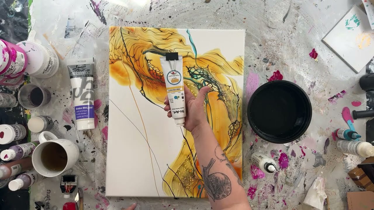 Live painting session. Abstract painting on a pour