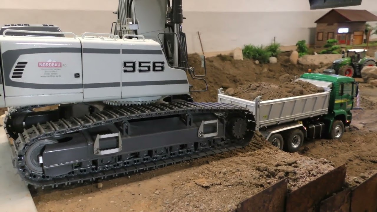 Liebherr 956 loads trucks at the bridge construction site
