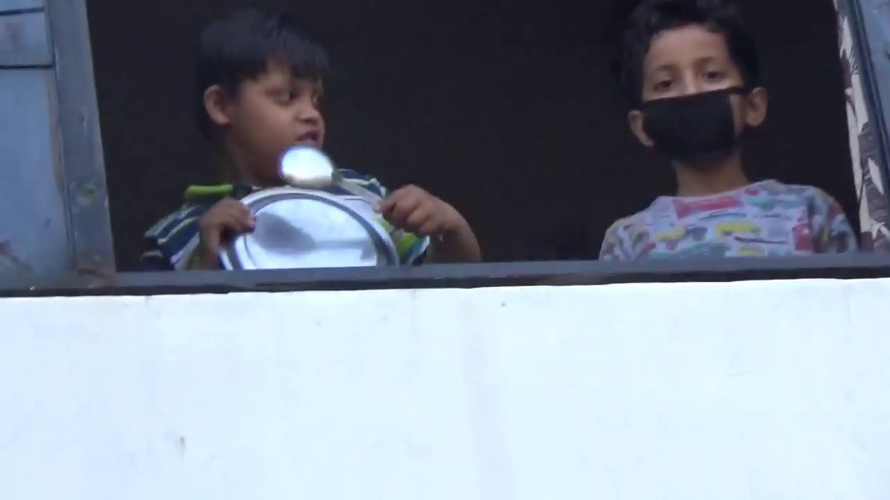 Kanpur, U.P., India - Young / Old People, kids clap, ring bells in the message of solidarity