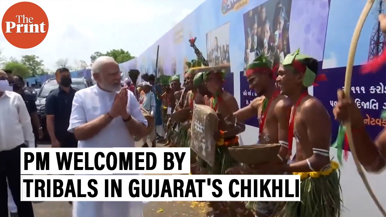 Prime Minister Narendra Modi gets a traditional welcome by tribals in Gujarat's Chikhli