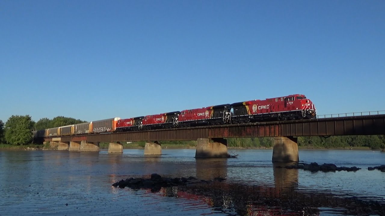 CP 7518 in CPKC paint leads CPKC 181 Northbound over the Iowa and Cedar Rivers in Fredonia, IA