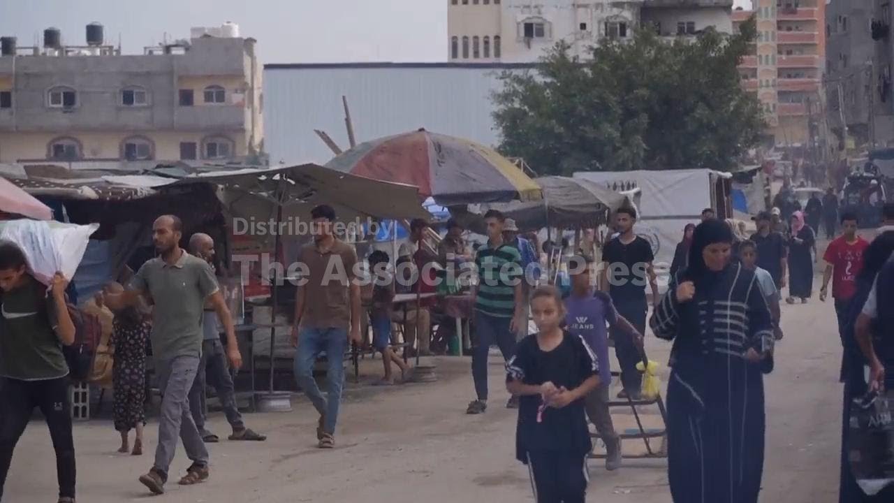 People in Deir al-Balah react as some countries recognize Palestinian state