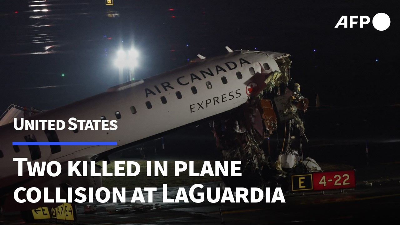Damaged plane at New York's LaGuardia Airport after collision with vehicle | AFP