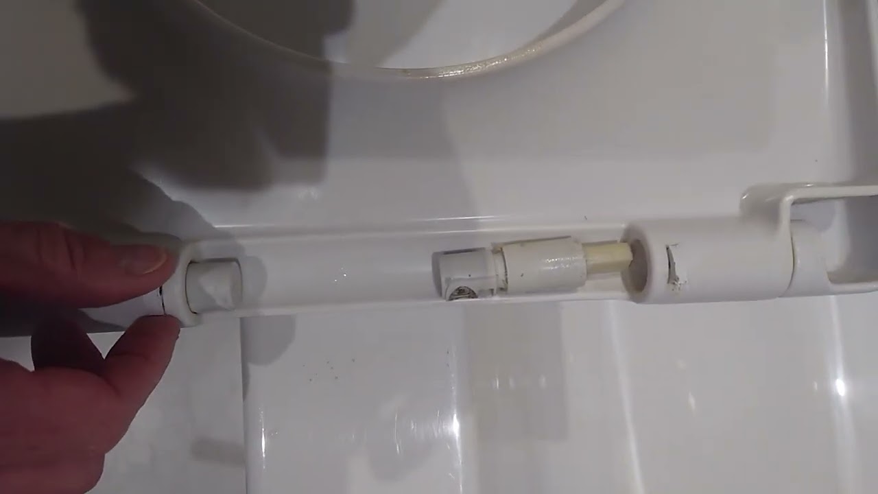 removing cover strips to dampners / cylinders / hinges villroy boch soft close toilet seat.