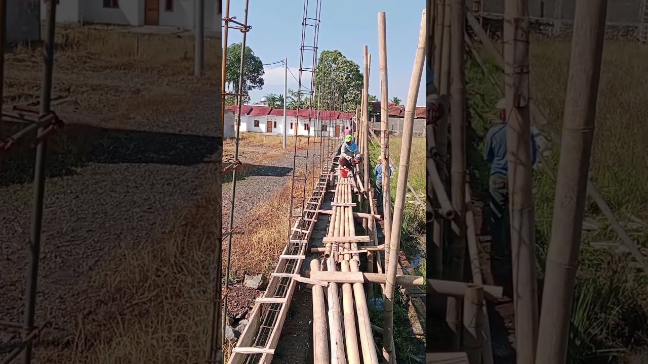 bamboo scaffolding on a stone foundation.