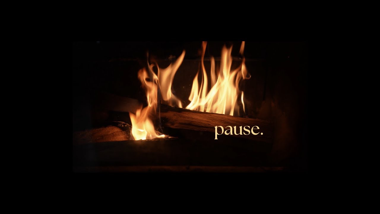 By the fire.