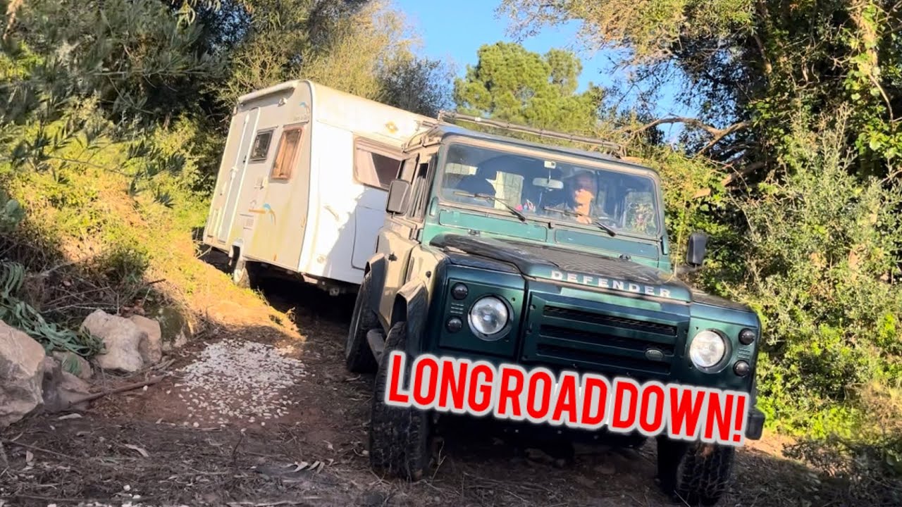 Towing a trailer down a narrow dirt road to the garden 
