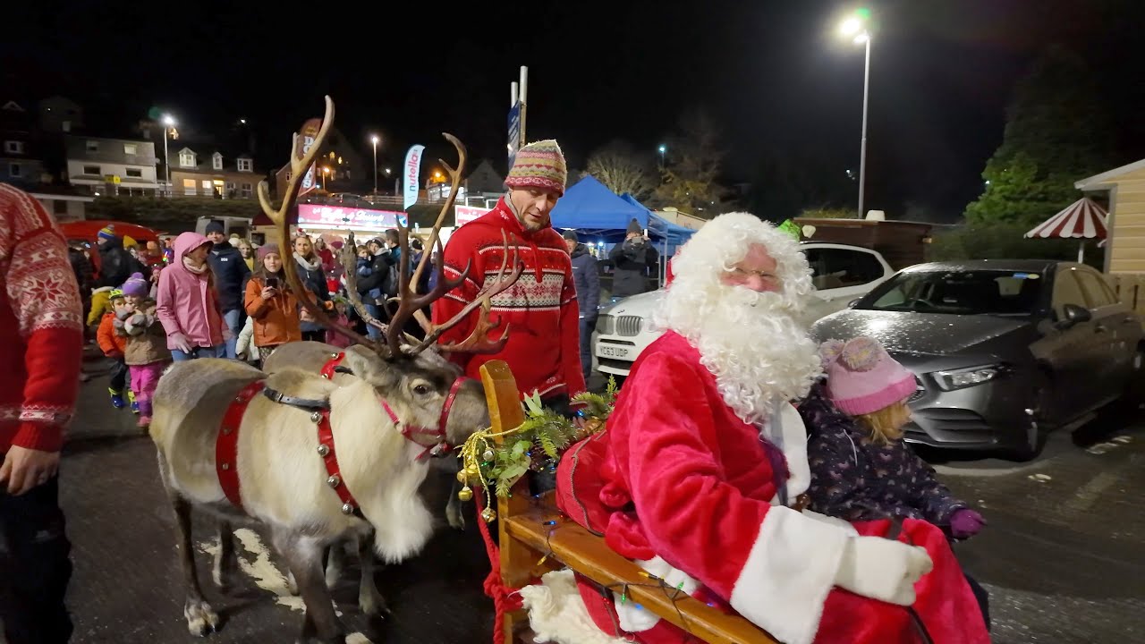 Santa on sleigh pulled by Reindeer during 2023 Banchory Christmas Festival and Lights switch on