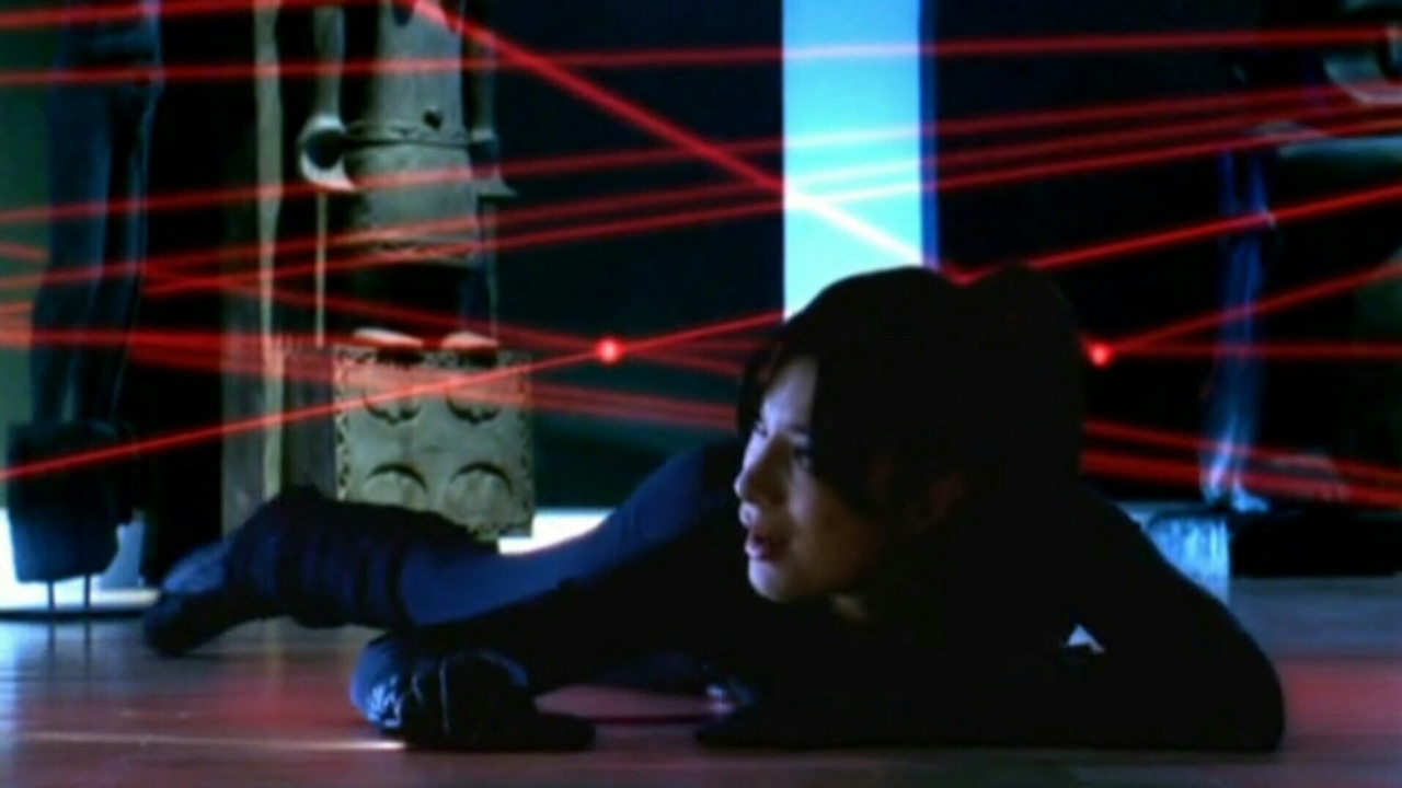 female burglar in a spandex catsuit