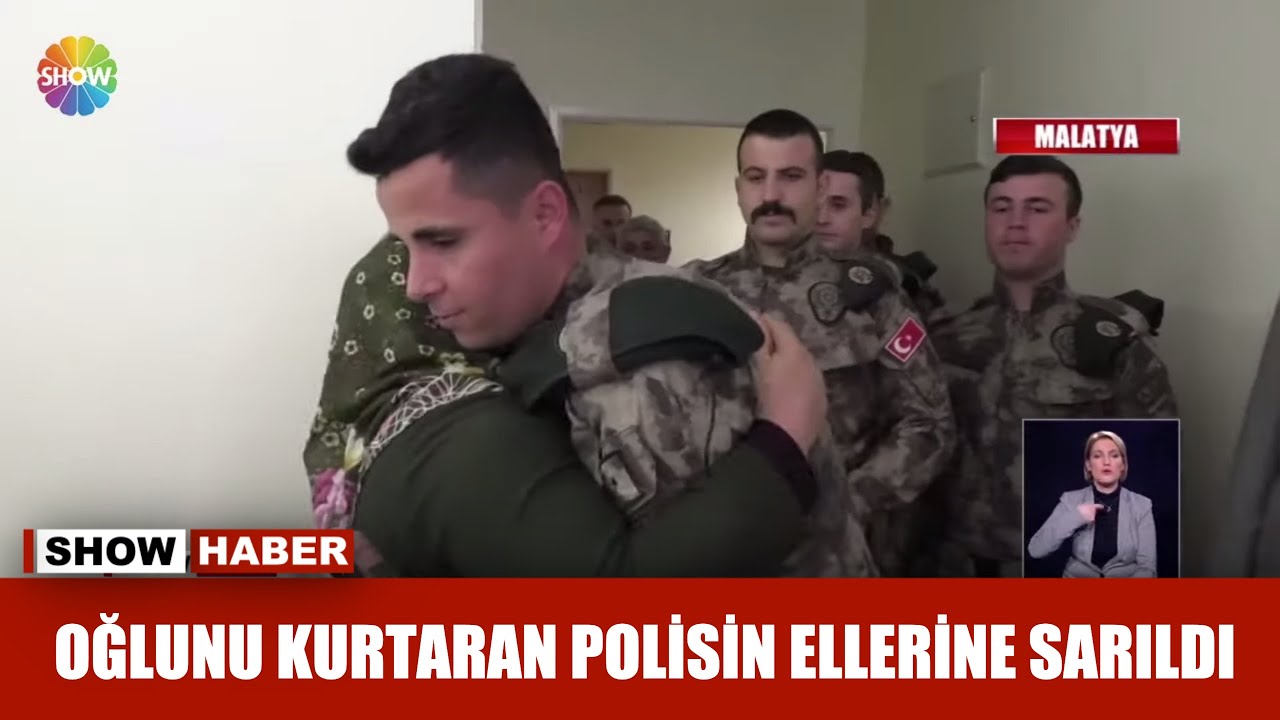 Oğlunu kurtaran polisin ellerine sarıldı