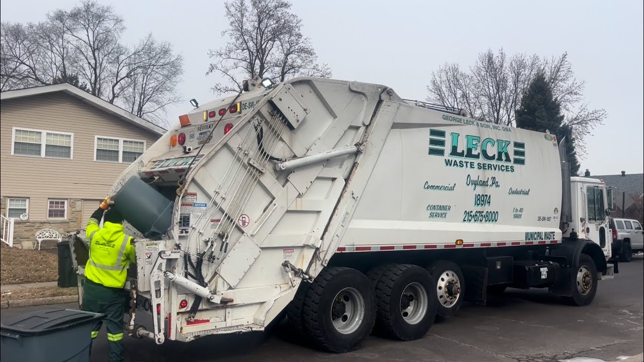 Leck Waste Services Mack MR NewWay rear loader garbage truck on manual trash