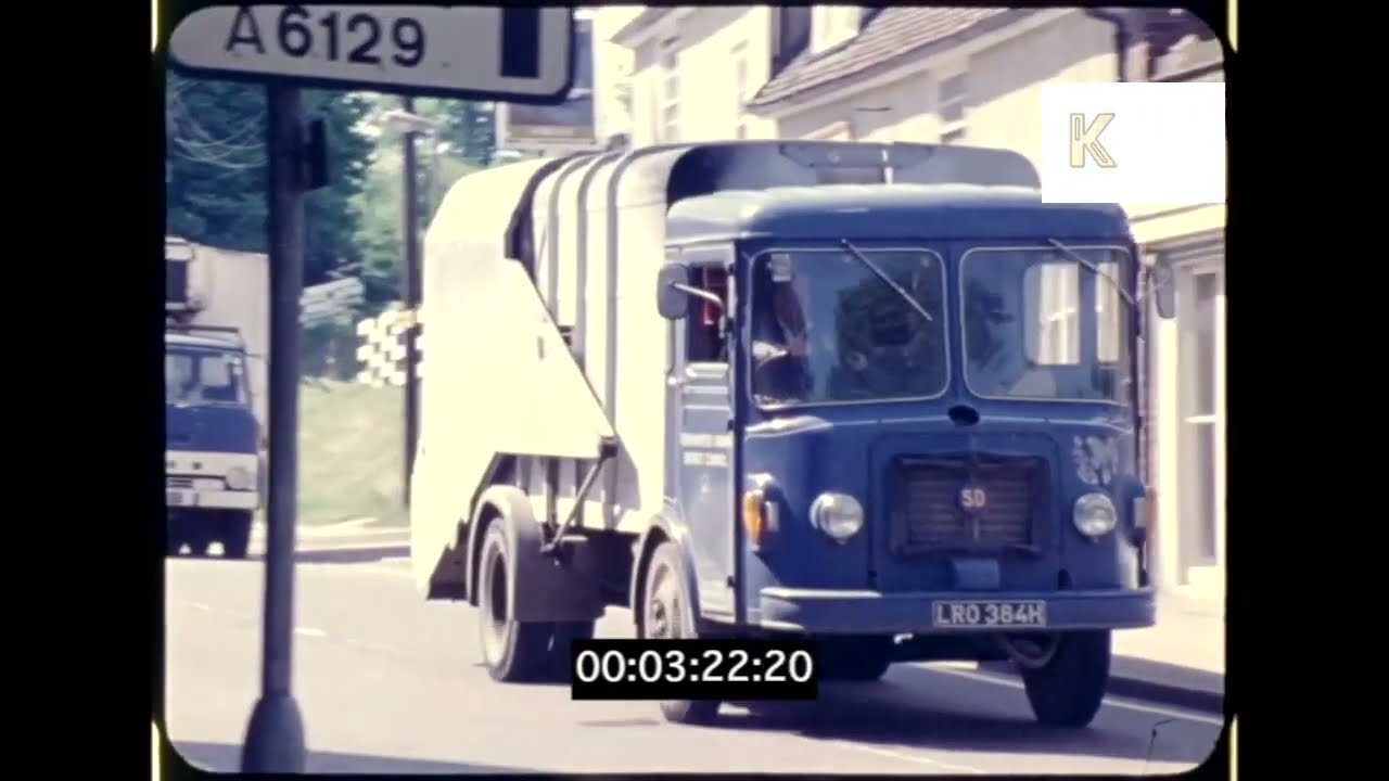 1970s UK, Rubbish Truck Driving Through Suburbs, 16mm