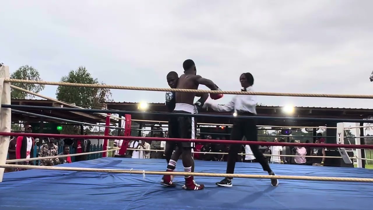 Shadreck Phwandaphwanda(black and white trunks) Vs Gift Elias (black and yellow trunks)
