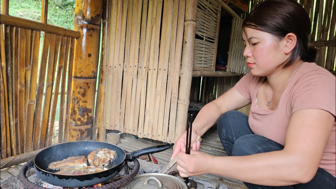 The girl lives alone and fishes for a living on the lake.