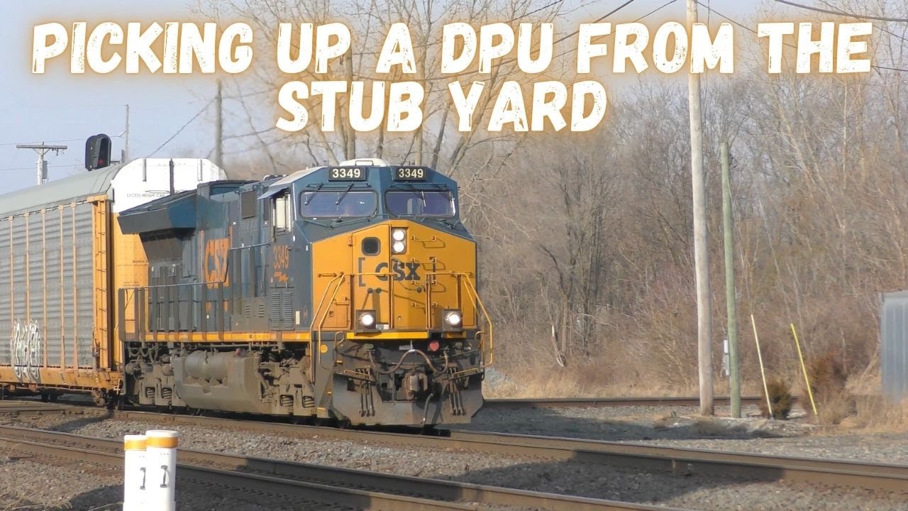 A super long and loaded Auto-rack train picks up a DPU from the Stub Yard in Marion, Ohio