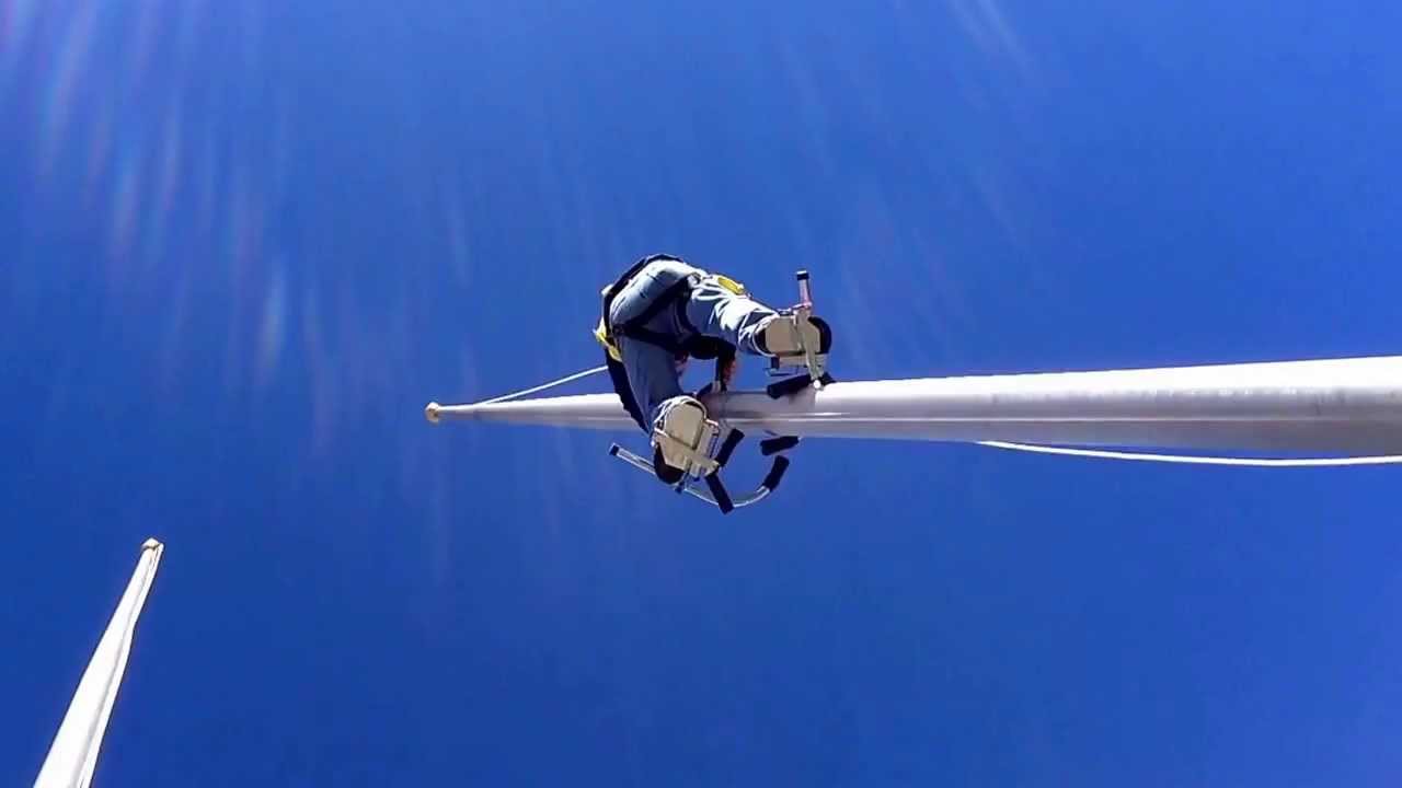 Flagpole climbing. Fixing a broken rope, then going to raise an American Flag.