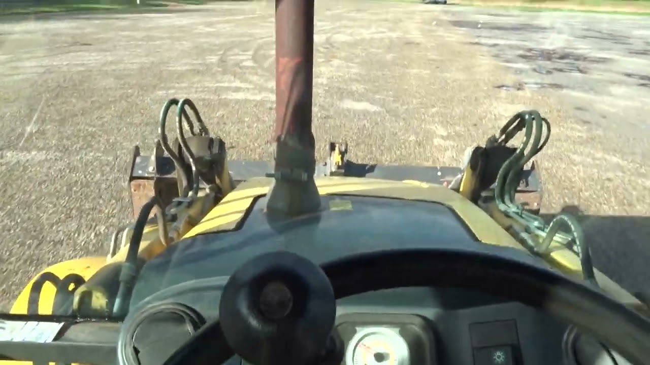 A bord du tracto New Holland b 110 c.
