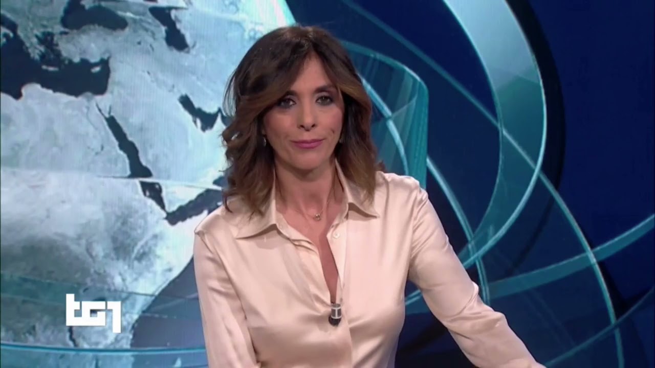 Emma D'Aquino in champagne satin blouse