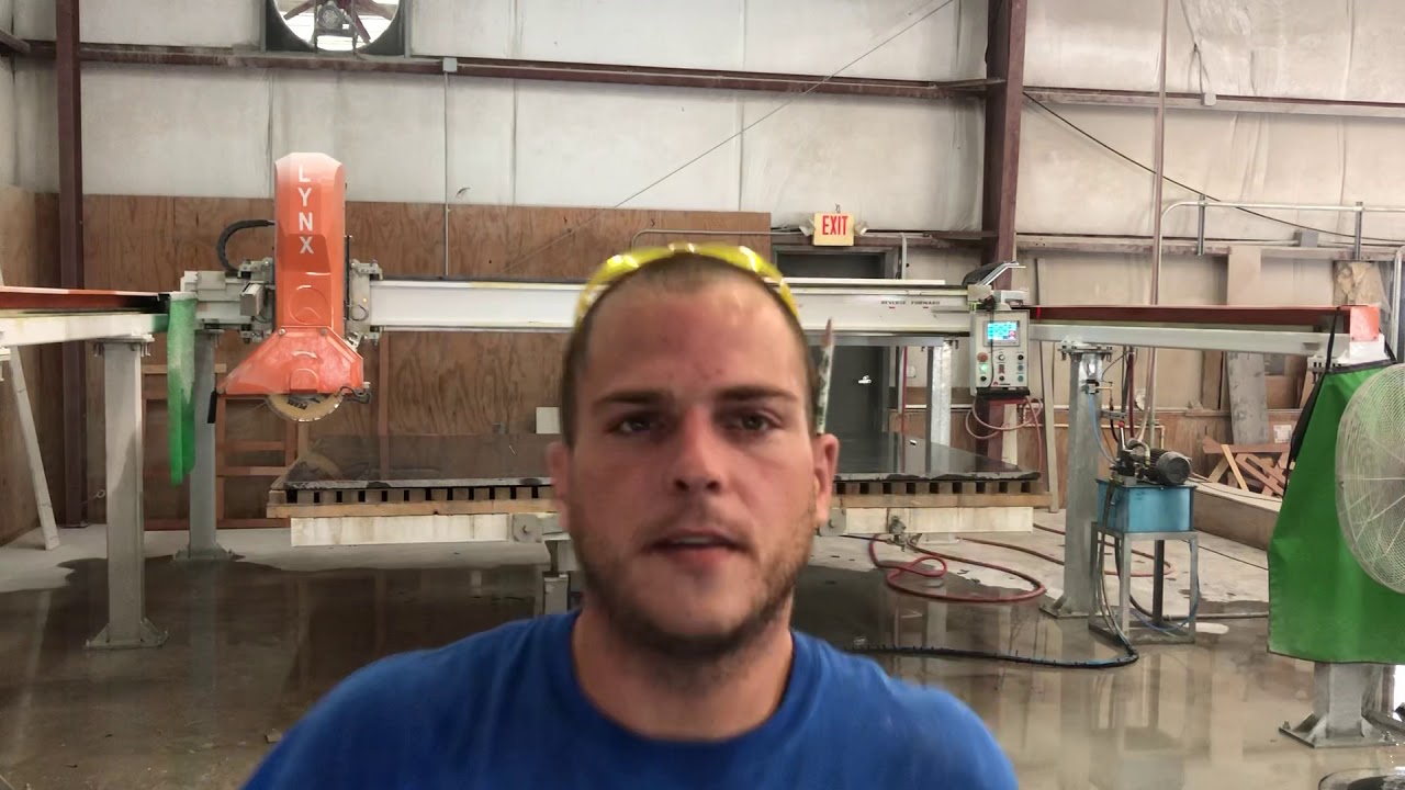 Cutting granite slab with bridge saw