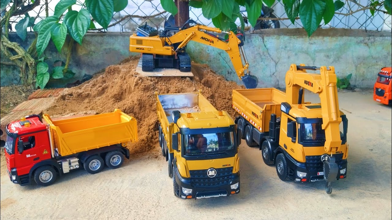 huina 1536,huina 1538 and truck dump transporting sand for hydroelectric power plant construction