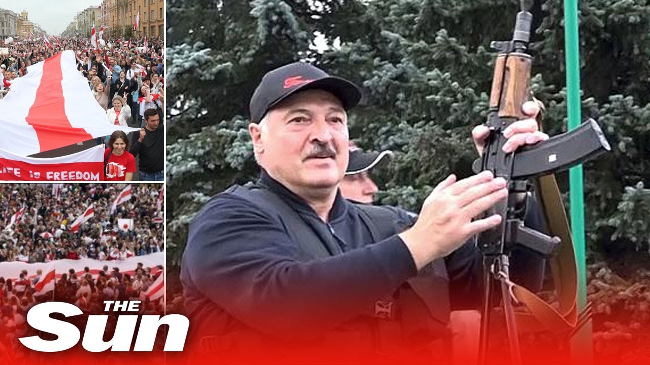 Belarus president brandishes assault rifle as thousands protest outside his residence